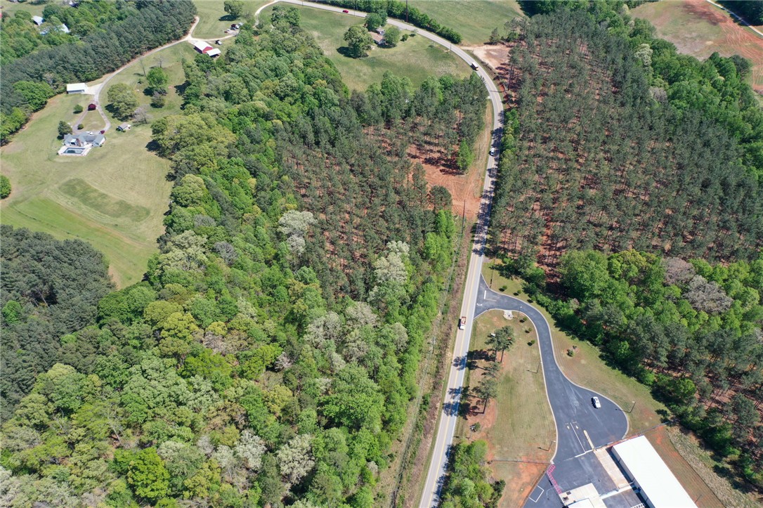 0 Burns Mill Road West Union, SC 29696 - Photo 5 of 10 Expansive acreage provides a verdant backdrop for serene living, offering both privacy and accessibility.