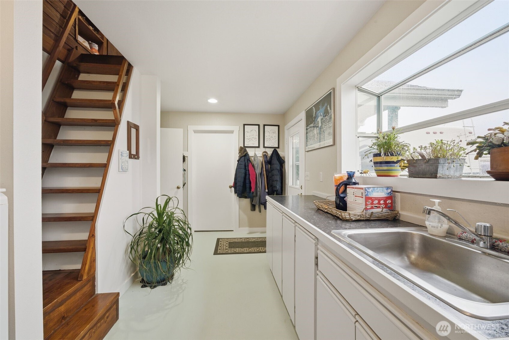 701 Jennings Street Sedro-Woolley, WA 98284 - Photo 16 of 40 a kitchen with a sink and a refrigerator