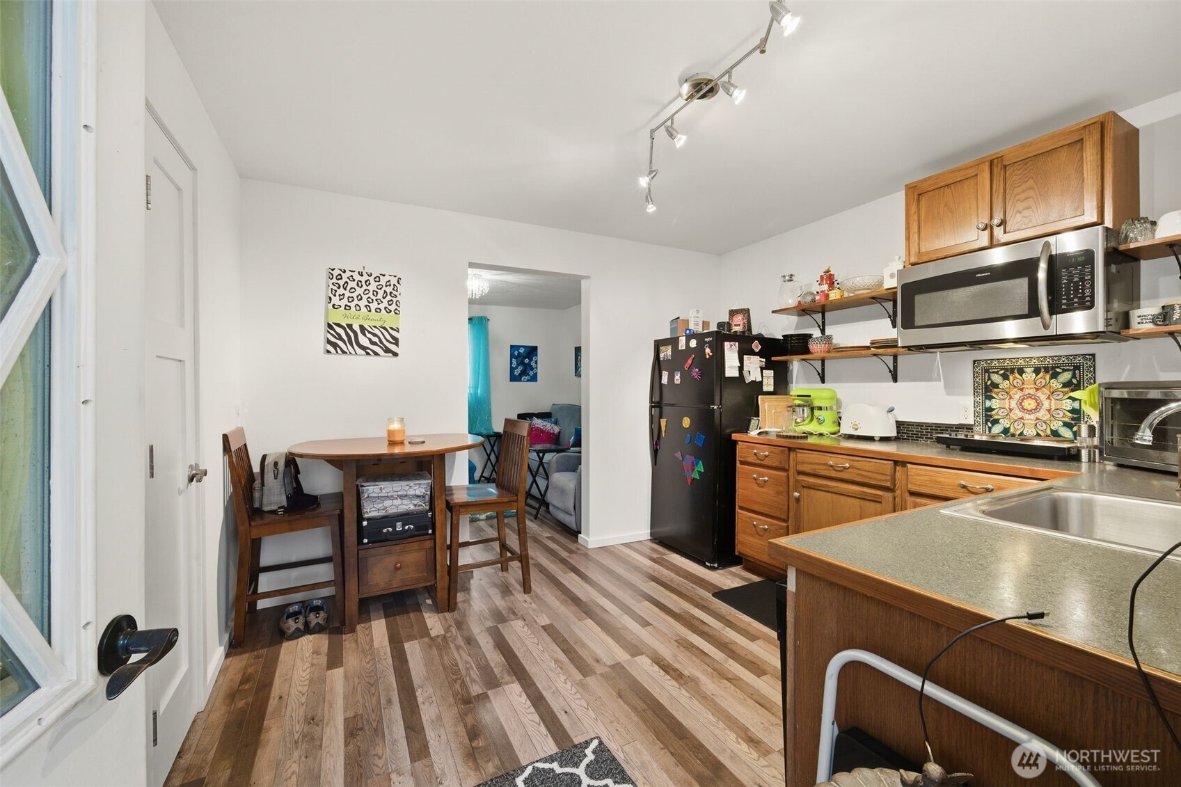 701 Jennings Street Sedro-Woolley, WA 98284 - Photo 21 of 40 a kitchen with stainless steel appliances granite countertop a refrigerator and a stove top oven