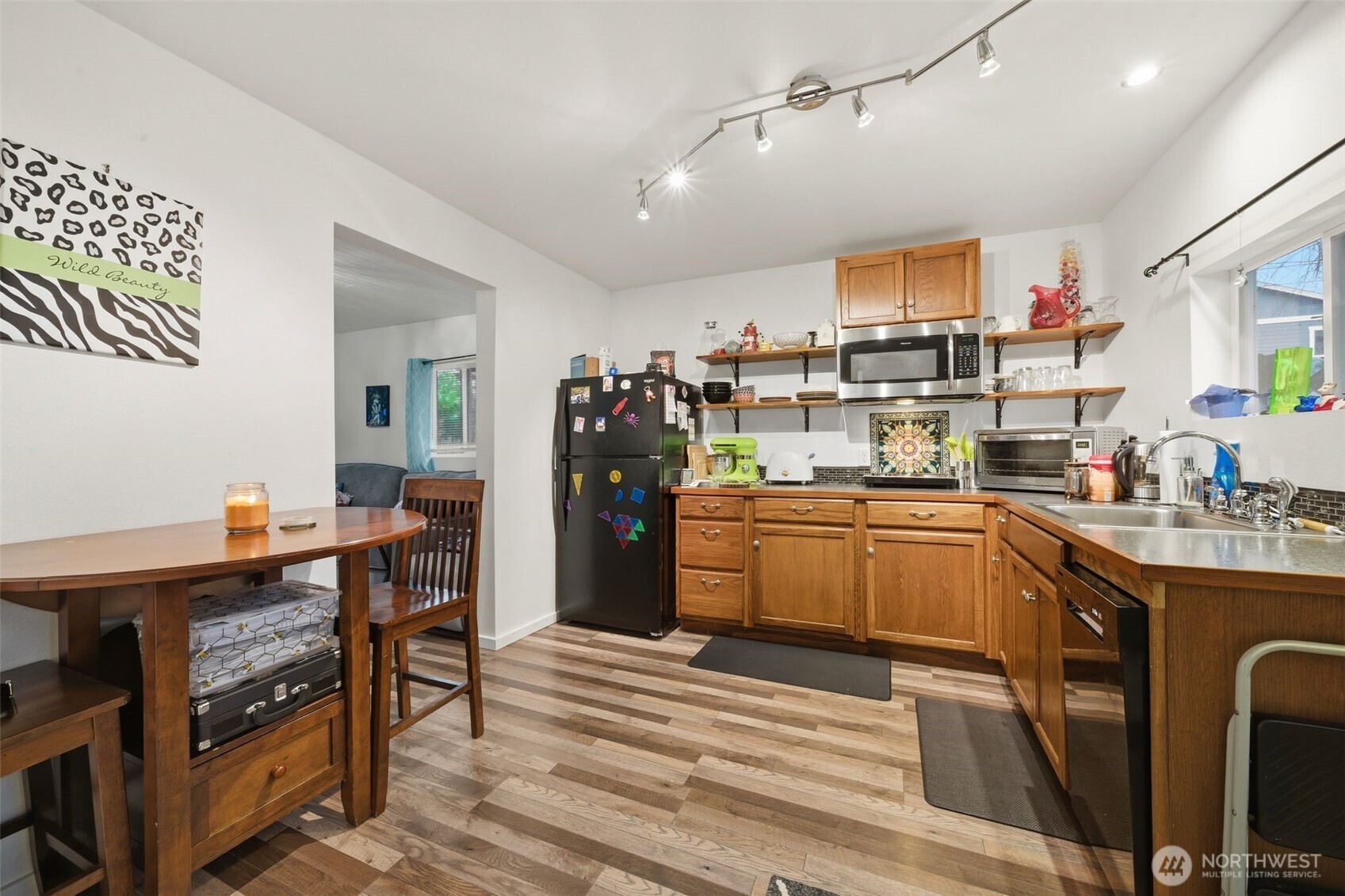 701 Jennings Street Sedro-Woolley, WA 98284 - Photo 22 of 40 a kitchen that has a lot of cabinets a sink and appliances in it