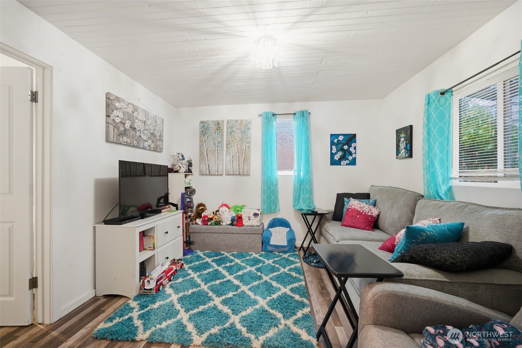 701 Jennings Street Sedro-Woolley, WA 98284 - Photo 24 of 40 a living room with furniture and a flat screen tv