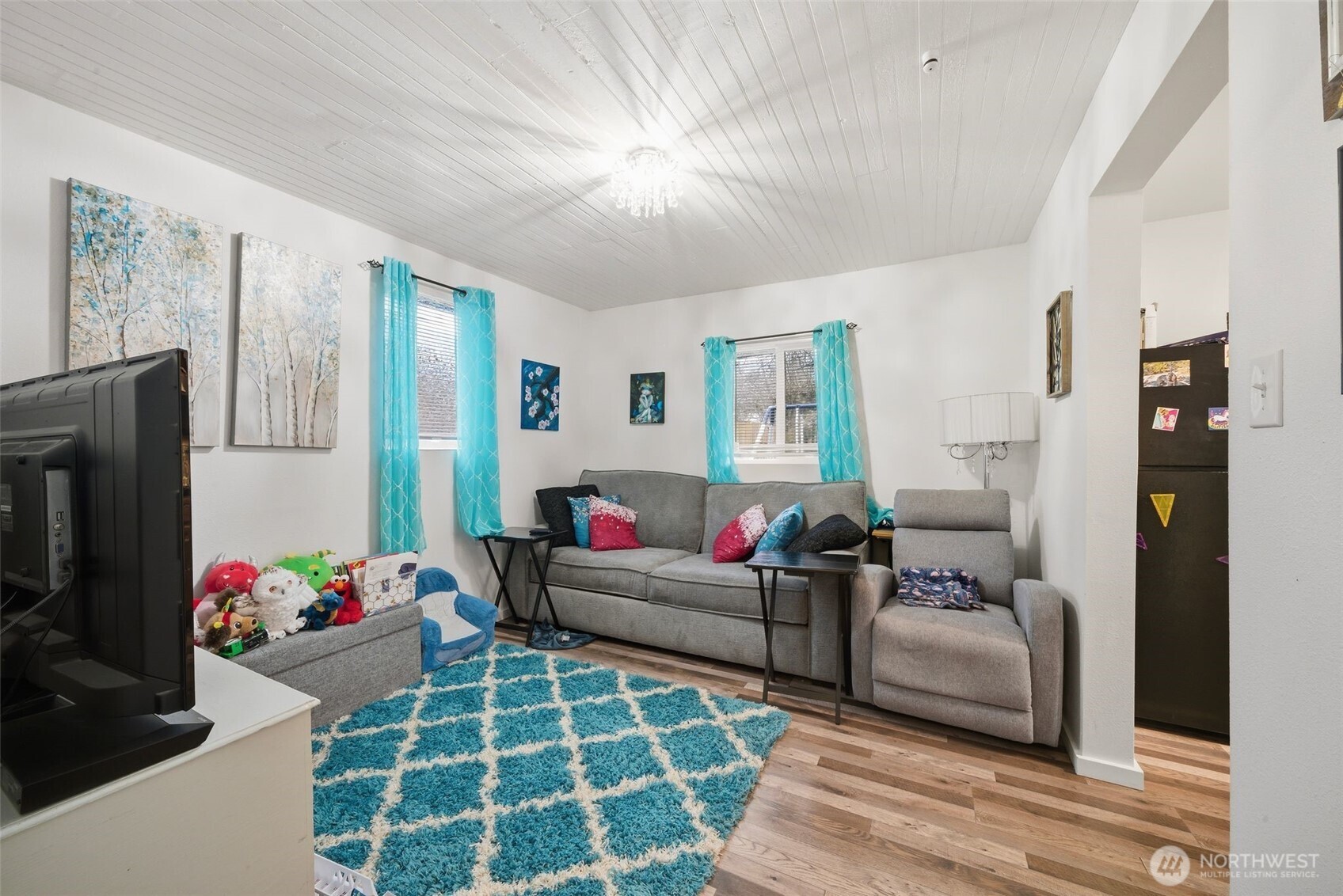 701 Jennings Street Sedro-Woolley, WA 98284 - Photo 25 of 40 a living room with furniture and a flat screen tv