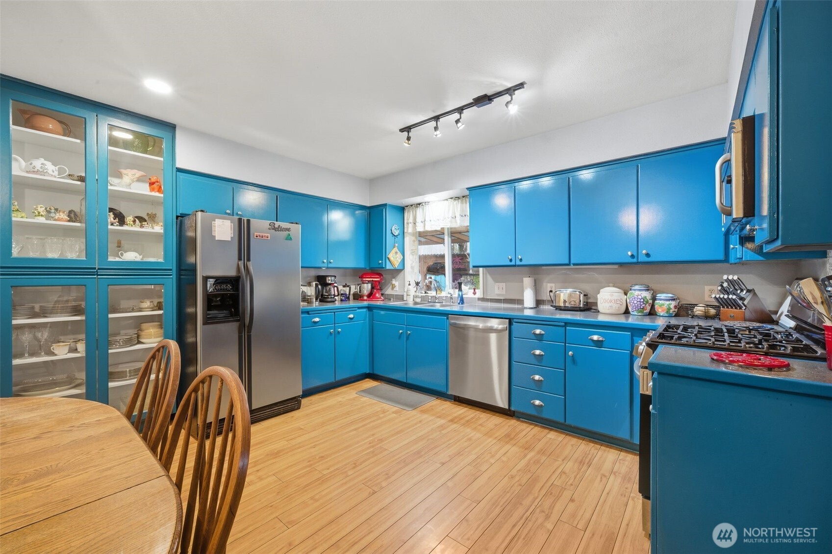 701 Jennings Street Sedro-Woolley, WA 98284 - Photo 8 of 40 a kitchen with stainless steel appliances granite countertop a refrigerator sink and wooden cabinets