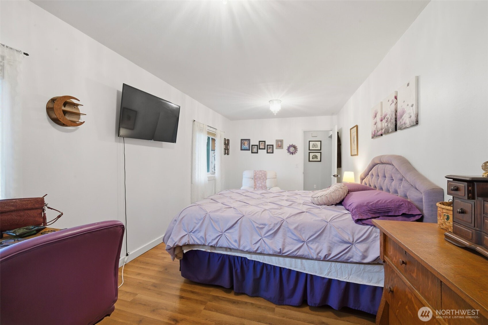 701 Jennings Street Sedro-Woolley, WA 98284 - Photo 9 of 40 a bedroom with a bed and a flat screen tv