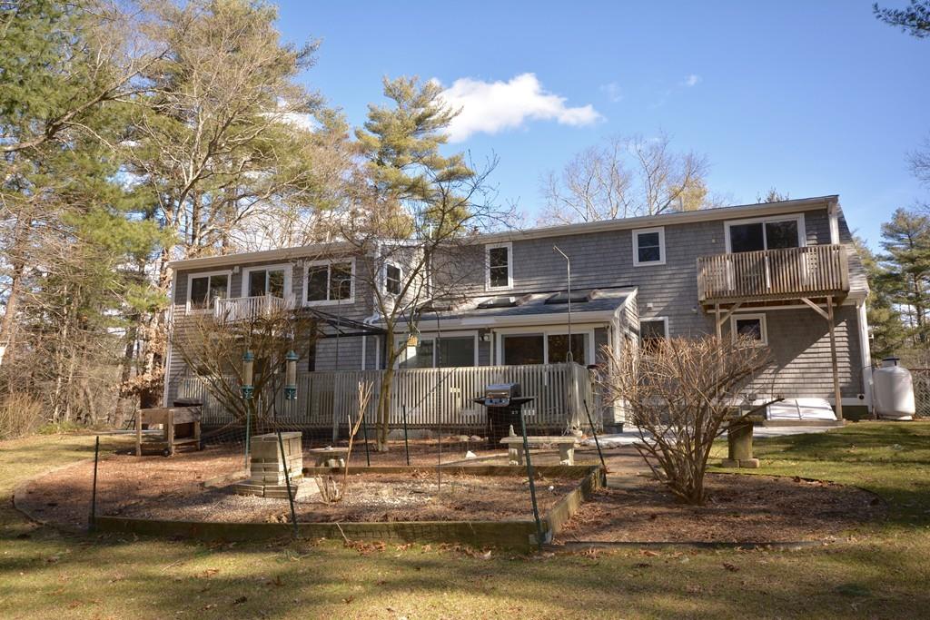 8 Betty Spring Road Freetown, MA 02717 - Photo 11 of 39 a front view of a house with a yard