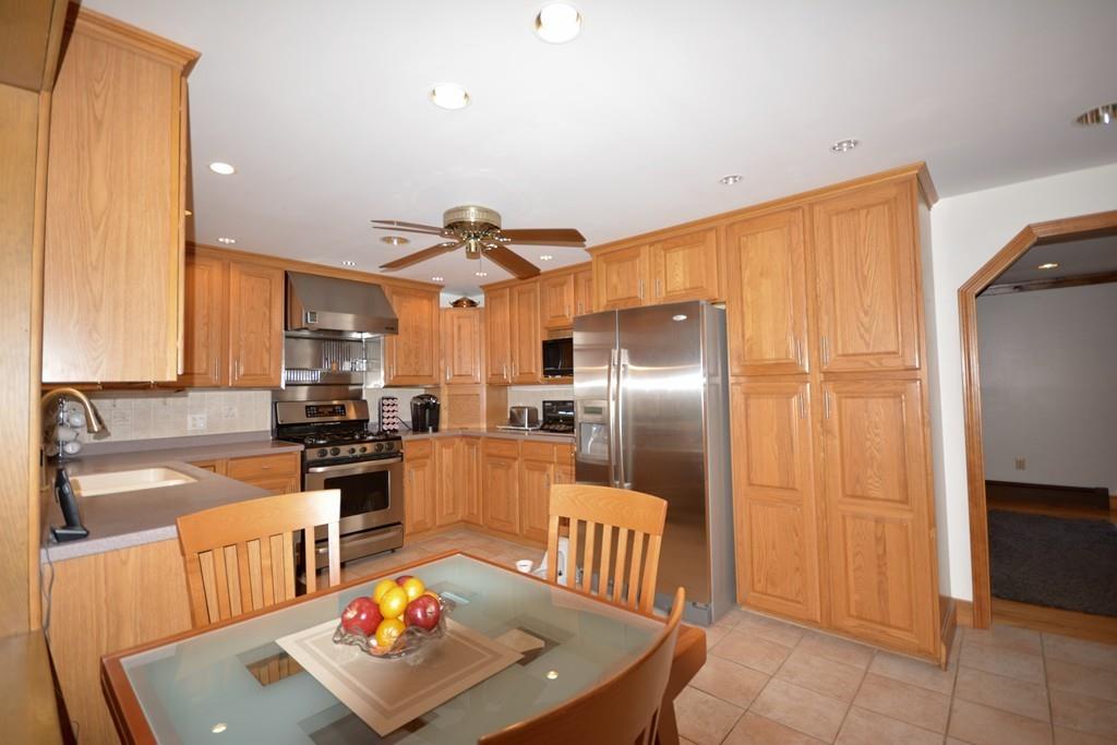 8 Betty Spring Road Freetown, MA 02717 - Photo 16 of 39 a kitchen with stainless steel appliances granite countertop a sink refrigerator and cabinets