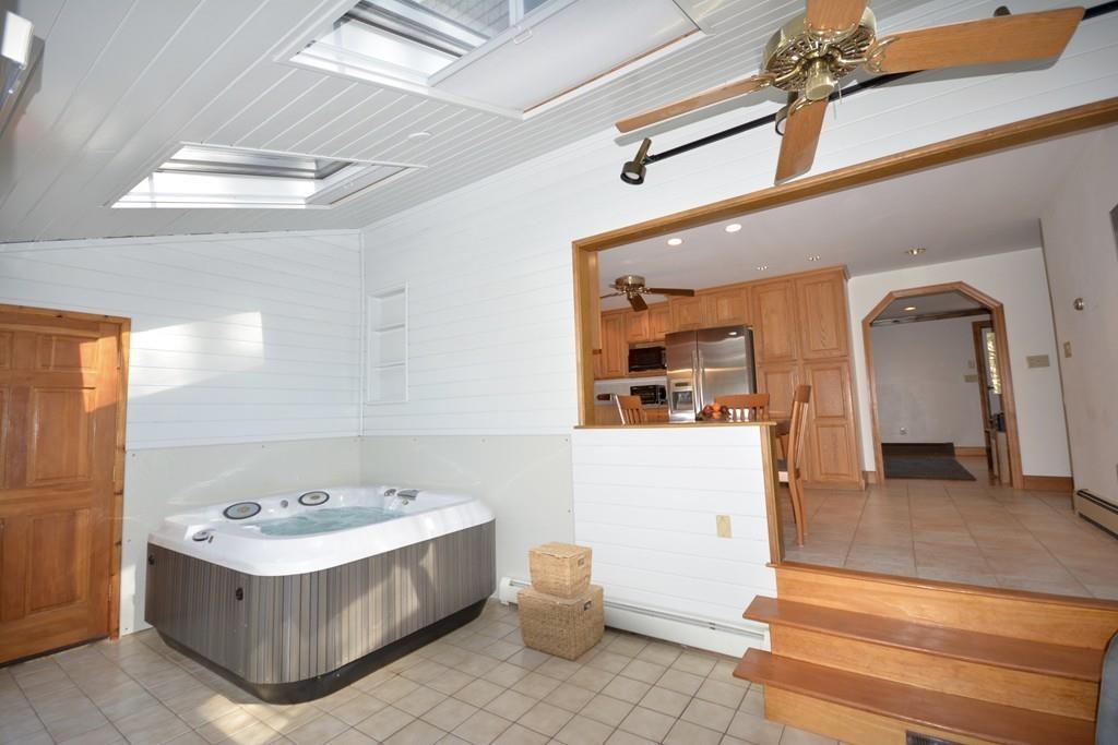8 Betty Spring Road Freetown, MA 02717 - Photo 17 of 39 a bathroom with a tub a sink and mirrors