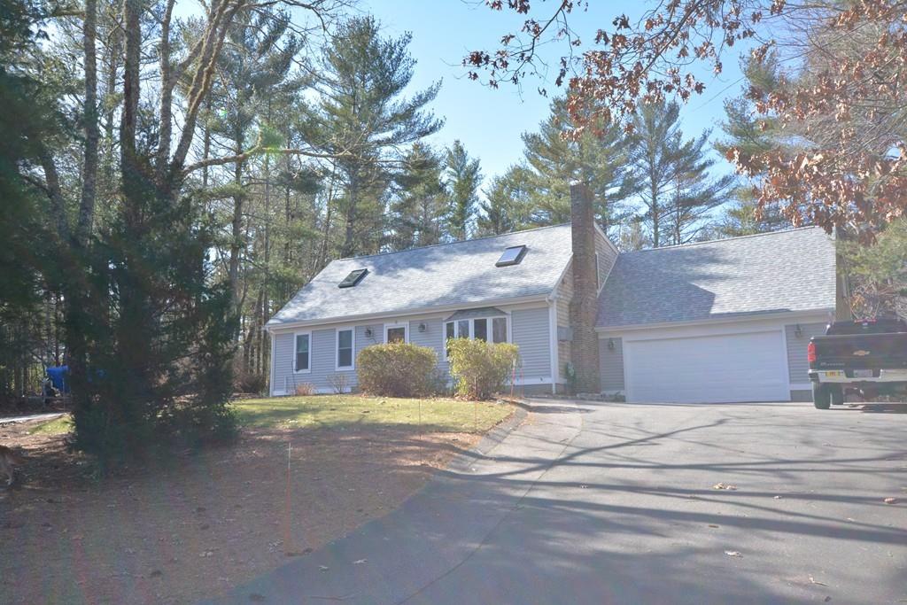 8 Betty Spring Road Freetown, MA 02717 - Photo 2 of 39 a front view of house with yard and trees around