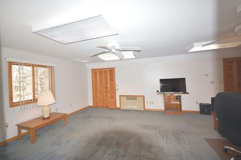 8 Betty Spring Road Freetown, MA 02717 - Photo 21 of 39 a living room with furniture and a flat screen tv