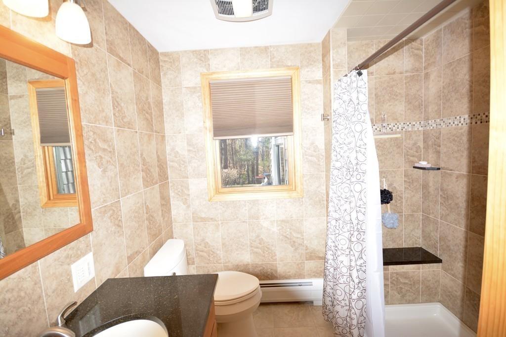 8 Betty Spring Road Freetown, MA 02717 - Photo 25 of 39 a bathroom with a bathtub and a shower