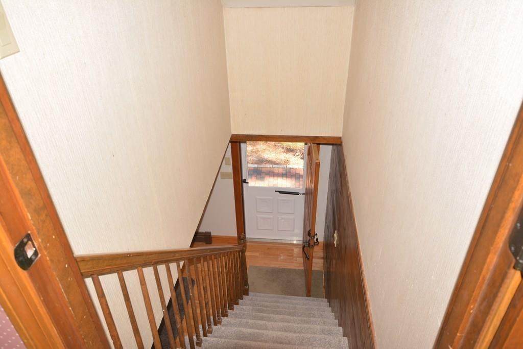 8 Betty Spring Road Freetown, MA 02717 - Photo 27 of 39 a view of a hallway with wooden floor and stairs