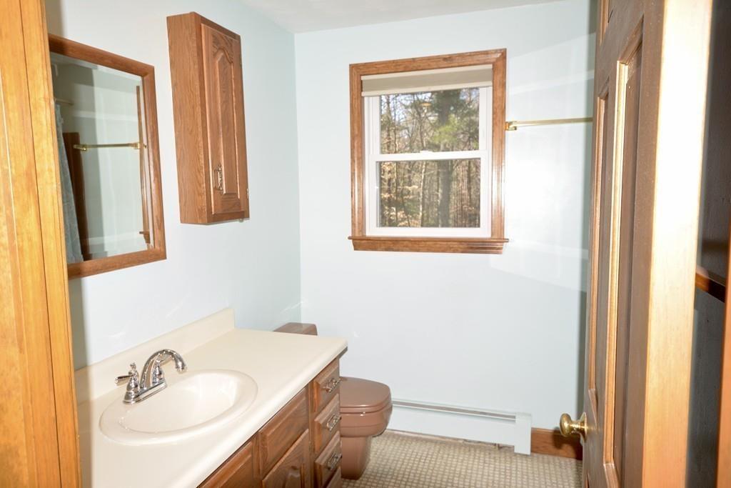 8 Betty Spring Road Freetown, MA 02717 - Photo 32 of 39 a bathroom with a sink and a mirror