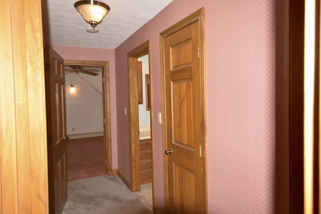 8 Betty Spring Road Freetown, MA 02717 - Photo 37 of 39 a view of a hallway and a livingroom with a front door