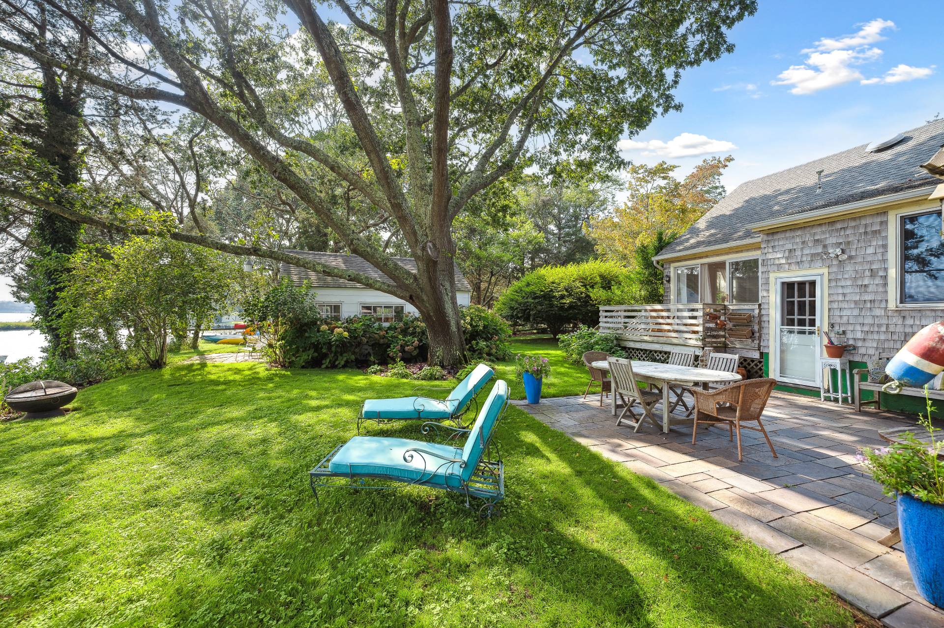 64 Towd Point Road Southampton, NY 11968 - Photo 3 of 21 a view of a house with backyard porch and sitting area