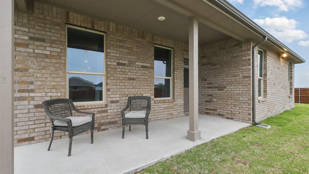 1241 Tree House Lane Decatur, TX 76234 - Photo 33 of 34 Patio- All Home and community information, including pricing, included features, terms, availability and amenities, are subject to change at any time without notice or obligation. All Drawings, pictures, photographs, video, square footages, floor plans, elevations, features, colors and sizes are approximate for illustration purposes only and will vary from the homes as built.