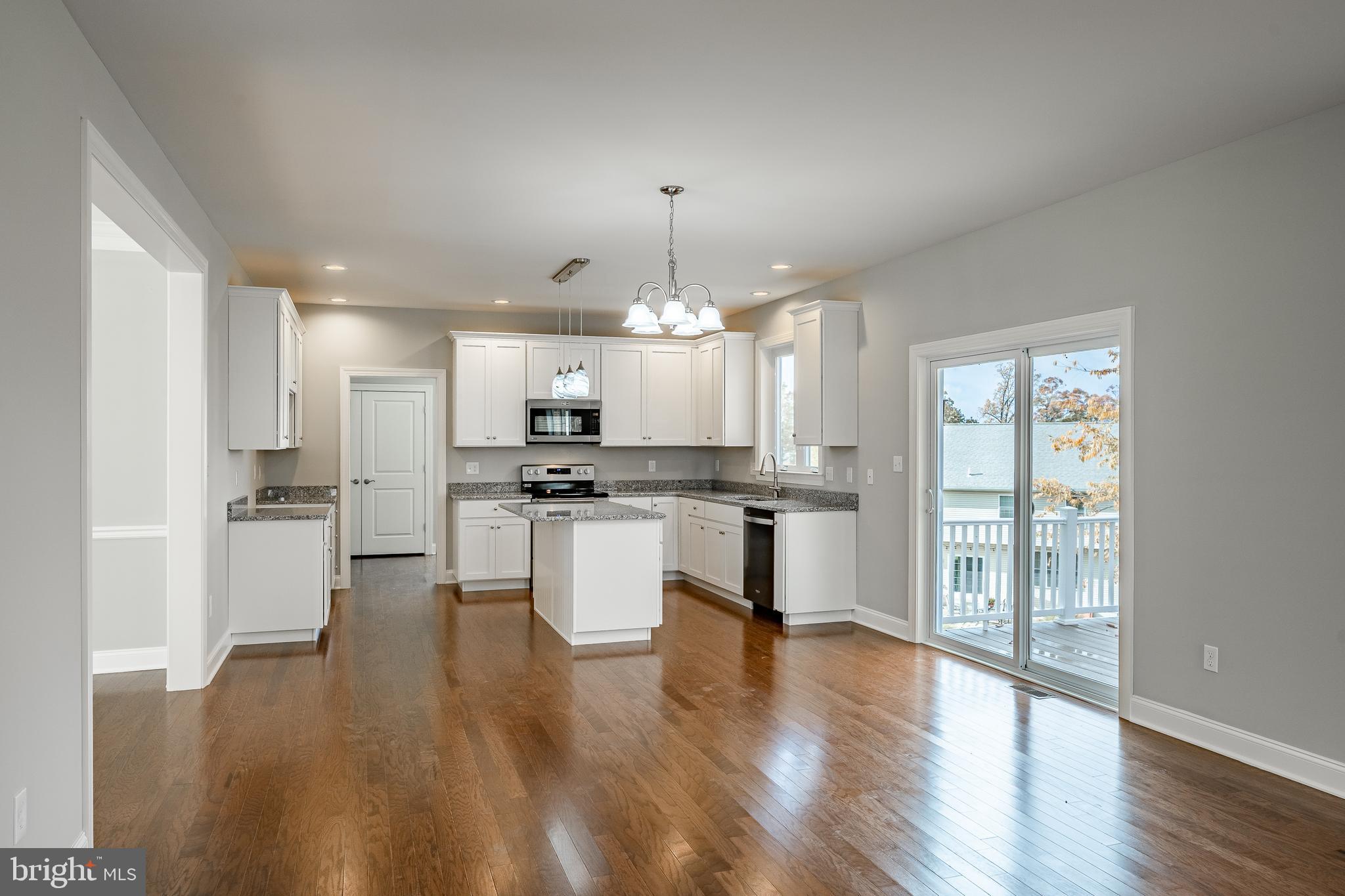 2158 Key Court Kutztown, PA 19530 - Photo 15 of 39 a open kitchen with white cabinets and wooden floor
