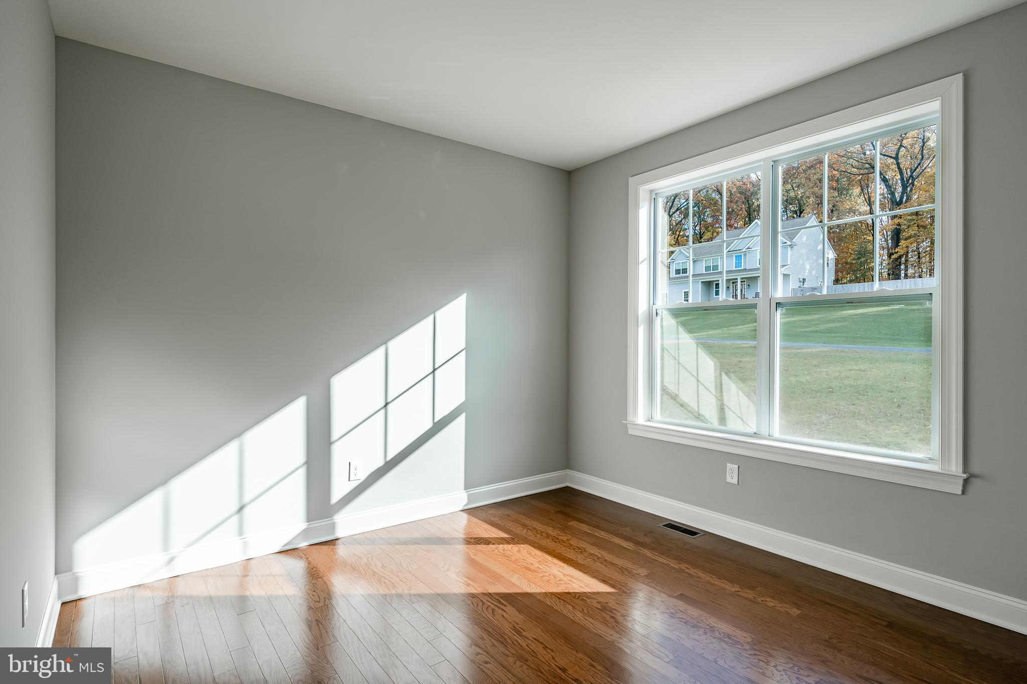2158 Key Court Kutztown, PA 19530 - Photo 19 of 39 a view of empty room with wooden floor and fan