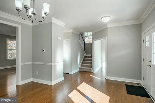 a view of entryway with wooden floor