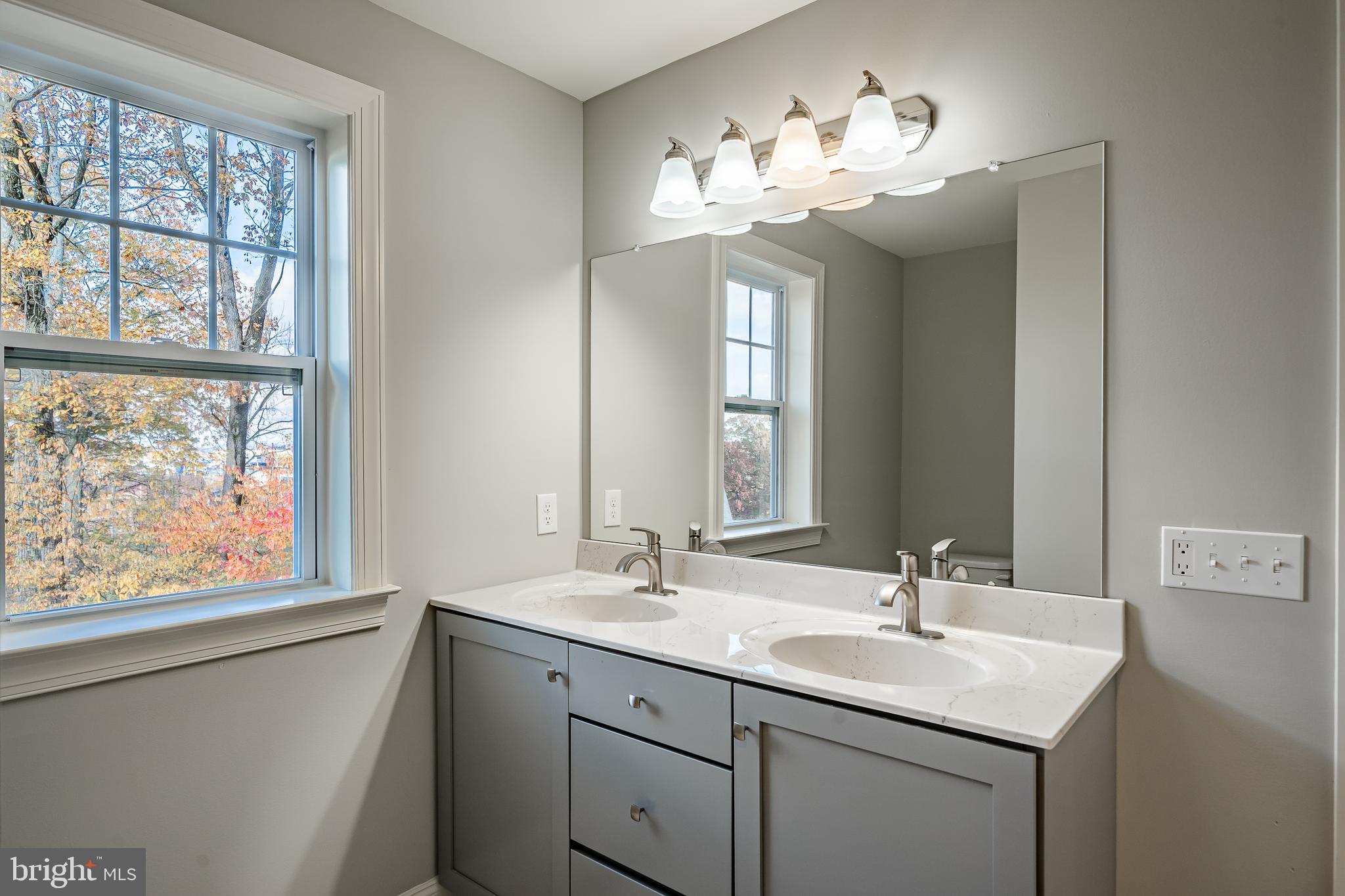 2158 Key Court Kutztown, PA 19530 - Photo 36 of 39 a bathroom with a sink and a large mirror