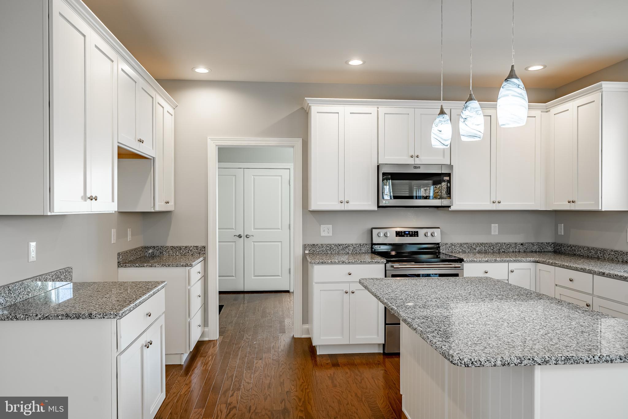 2158 Key Court Kutztown, PA 19530 - Photo 5 of 39 a kitchen with stainless steel appliances granite countertop a sink stove and microwave