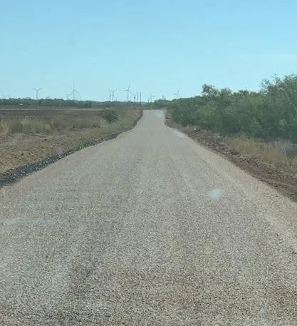 a view of a field with beach