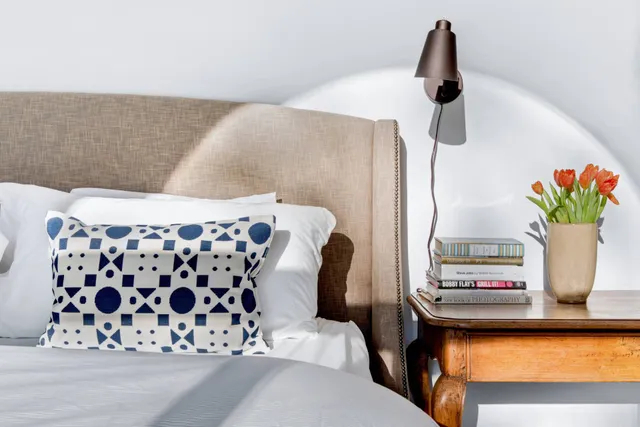 a bedroom with a bed and a couch