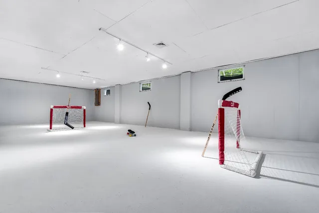 a view of a wooden deck and a yard