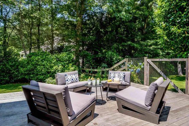 a view of backyard with furniture and garden
