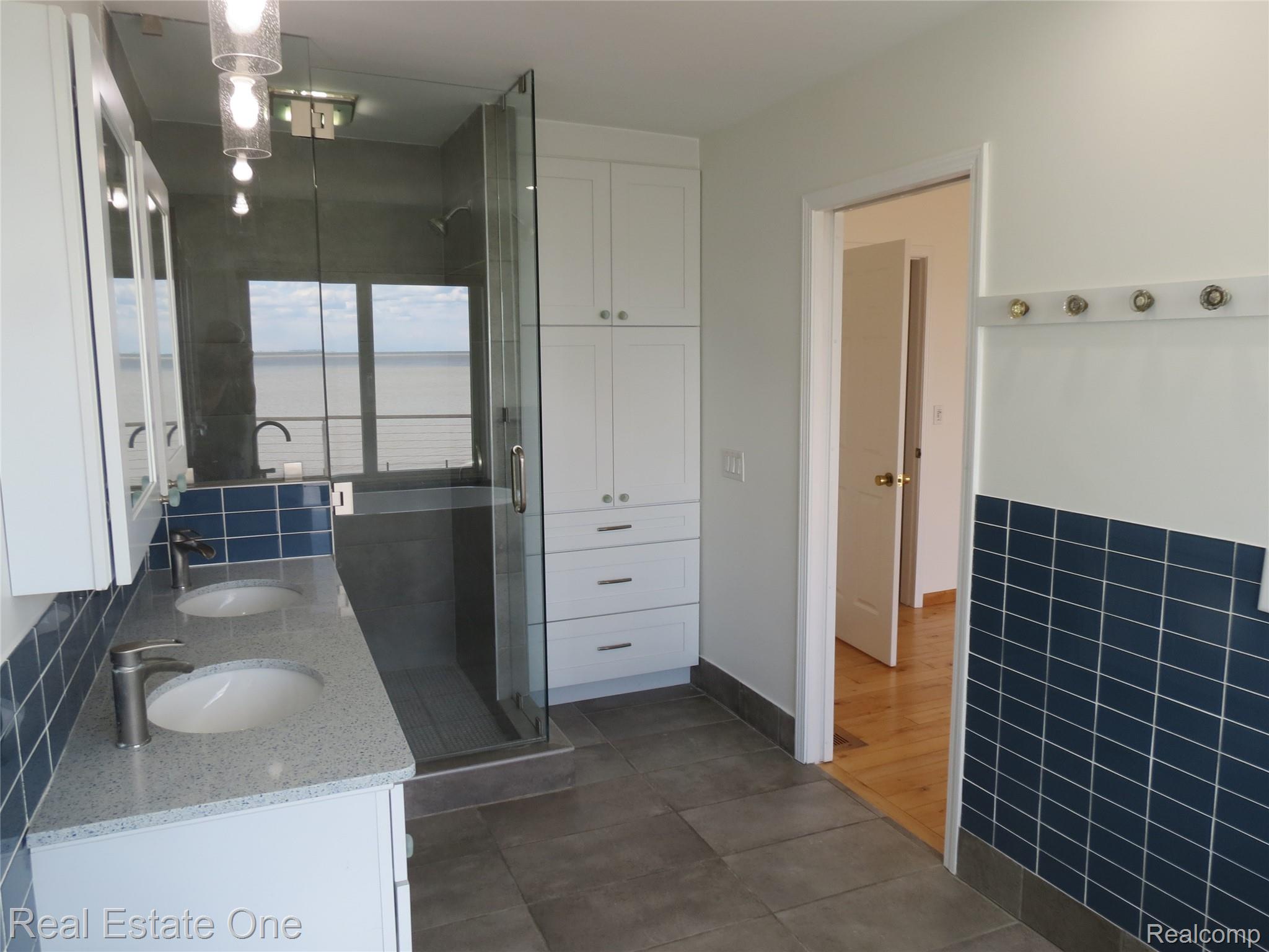 4583 Allen Cove Road Luna Pier, MI 48157 - Photo 34 of 50 Linen storage and ceramic tile floors.