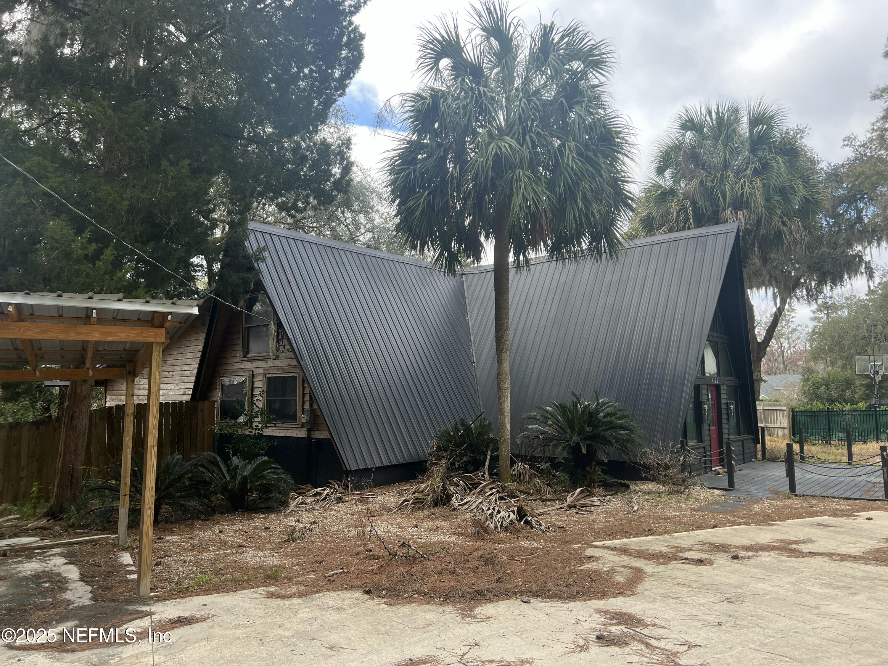 4122 Hillwood Road Jacksonville, FL 32223 - Photo 2 of 11 a view of a house with a park