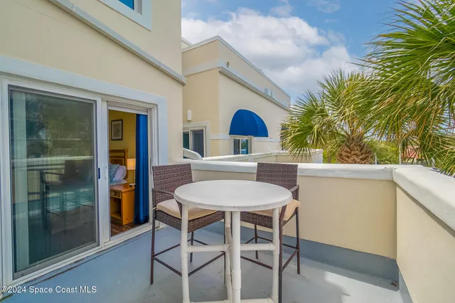 a view of a dining room with furniture and window