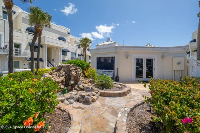 a view of a house with patio front of house