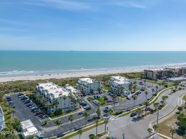 an aerial view of beach and ocean