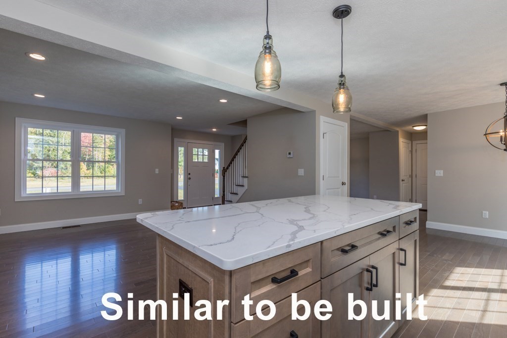 206 Westminster Road Princeton, MA 01541 - Photo 3 of 17 a view of a kitchen island a sink wooden floor and a chandelier