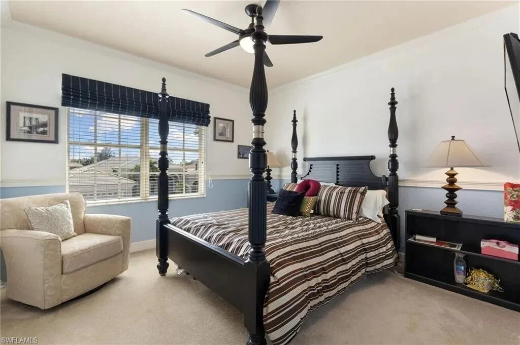 19460 La Serena Drive Estero, FL 33967 - Photo 18 of 30 a bed room with furniture and a chandelier