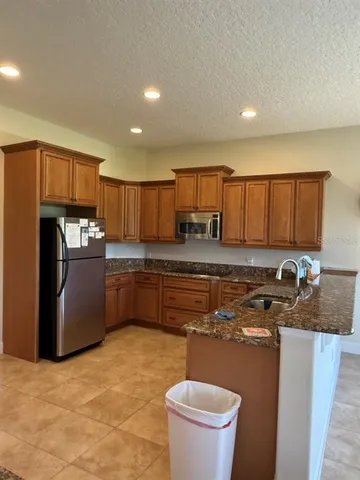 a kitchen with a stove and a sink
