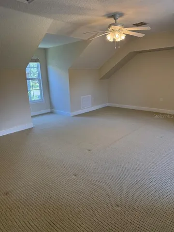 a view of a garden with an outdoor seating