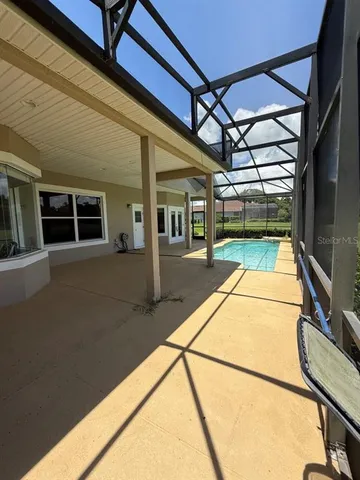 a front view of a house with yard and green space