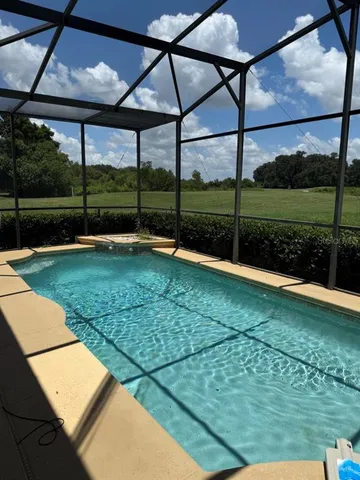 a view of a backyard with a garden and plants