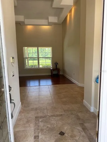 a view of empty room with windows