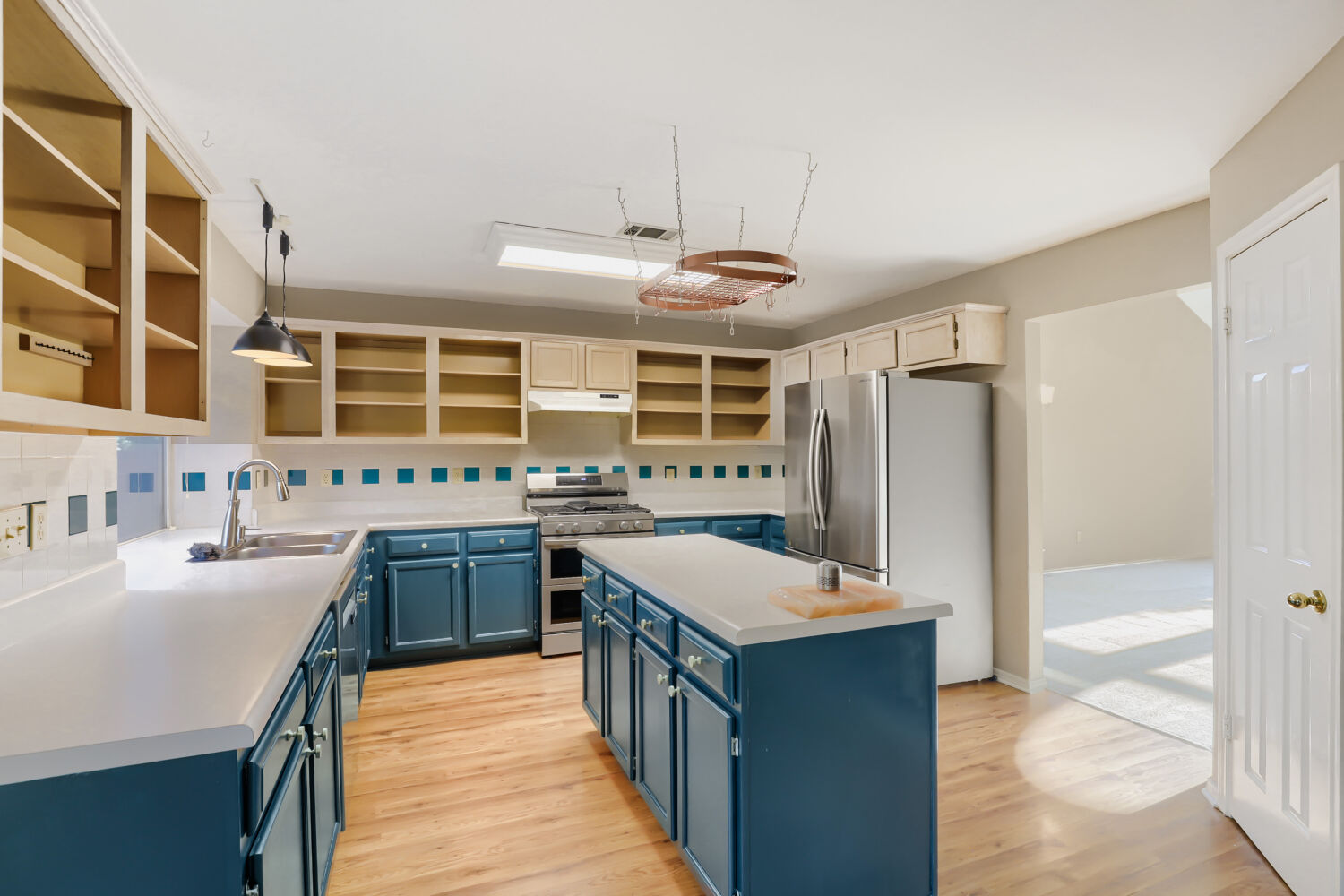 17204 Village Glen Road Pflugerville, TX 78660 - Photo 9 of 19 Kitchen with large pantry, gas stove/oven, & island.