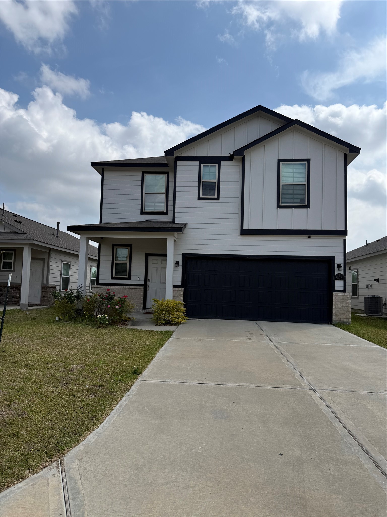 20931 Endeavor Street Porter, TX 77365 - Photo 1 of 15 a front view of a house with garden