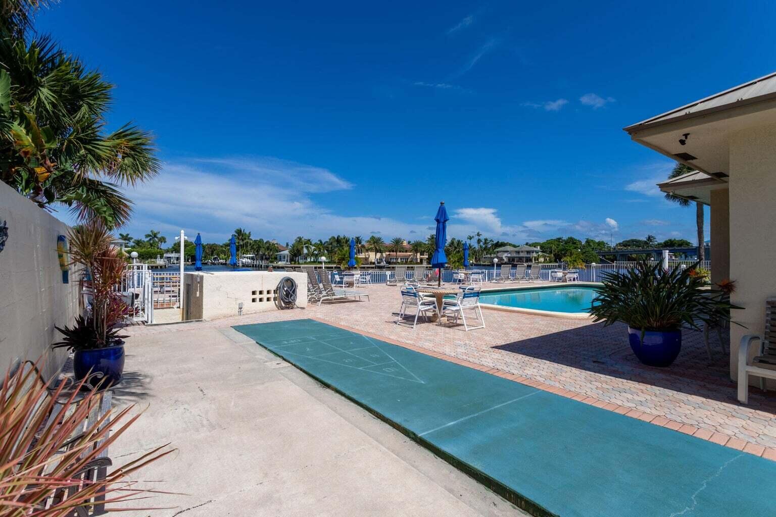 640 Snug Harbor Drive, Unit F6 Boynton Beach, FL 33435 - Photo 27 of 29 a view of a backyard and fire pit