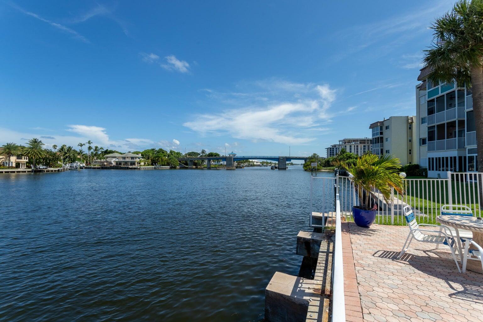 640 Snug Harbor Drive, Unit F6 Boynton Beach, FL 33435 - Photo 7 of 29 a view of a lake with a house in the background