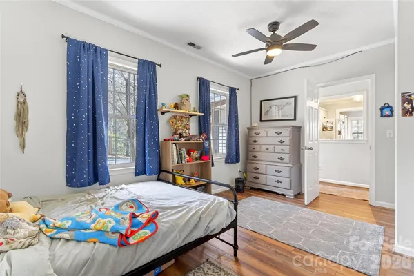a bedroom that has a bed and a closet