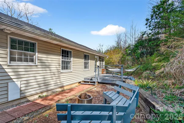 a view of backyard with seating space