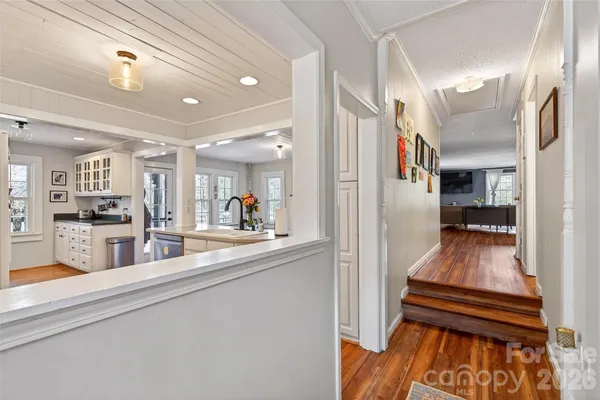 a view of kitchen with cabinets and wooden floor