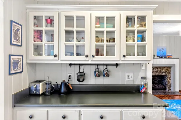 a view of counter top with table and chairs