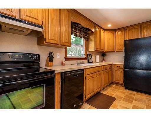 91 Mildred Avenue Springfield, MA 01104 - Photo 12 of 41 a kitchen with a refrigerator sink and cabinets