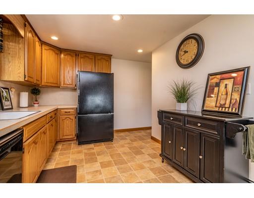 91 Mildred Avenue Springfield, MA 01104 - Photo 14 of 41 a kitchen with stainless steel appliances granite countertop a refrigerator a stove and a sink